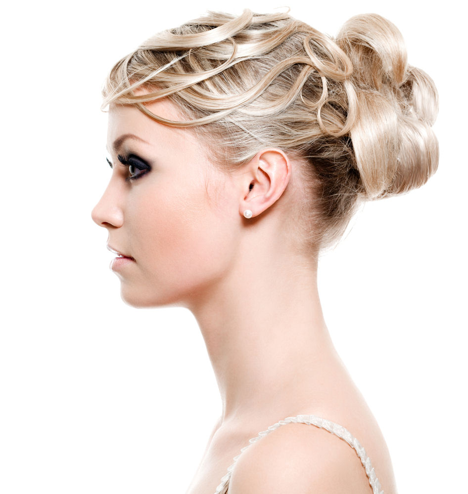 Profile view of fair maiden sporting blonde bun hairstyle
