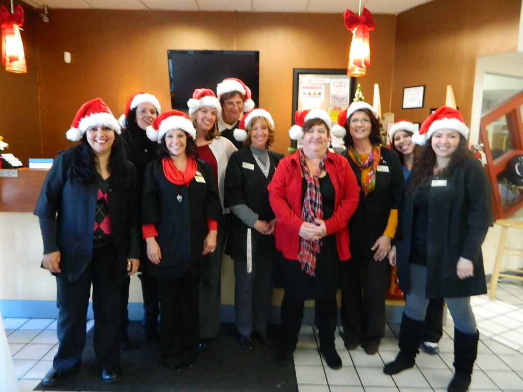 Santa Hats on our staff! Happy Holidays!