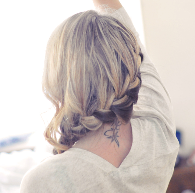 Girl with braids and neck tatoo