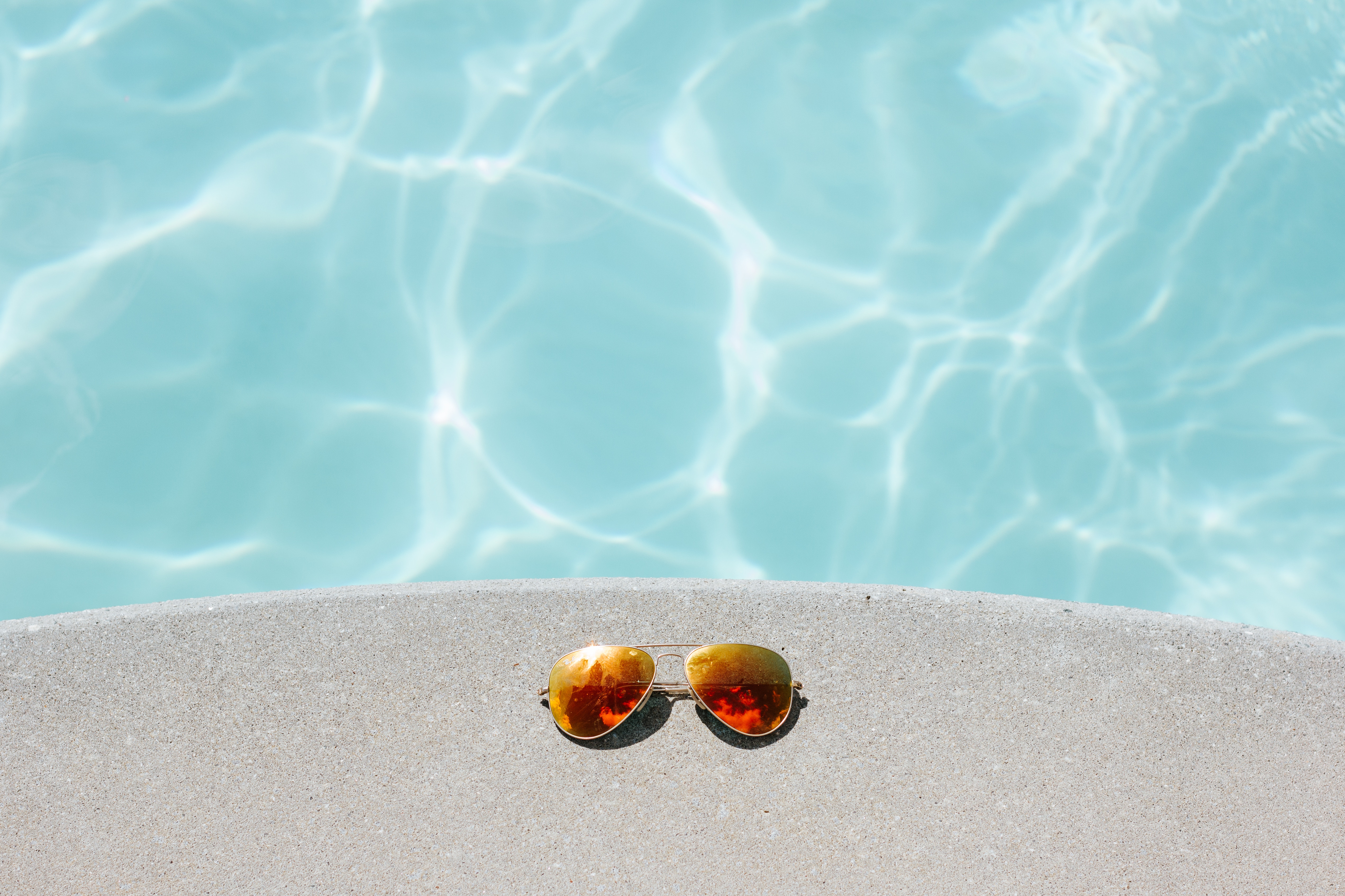 glasses near the pool