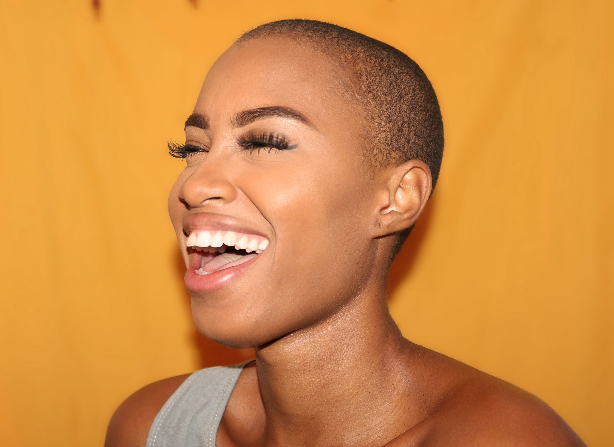 black woman with beautiful skin laughing