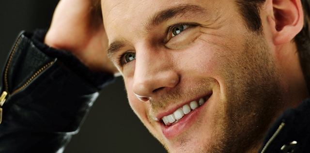 Smiling man in leather jacket