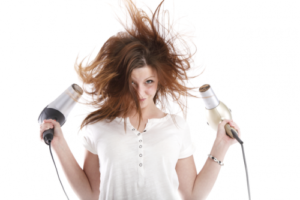 woman blow-drying hair