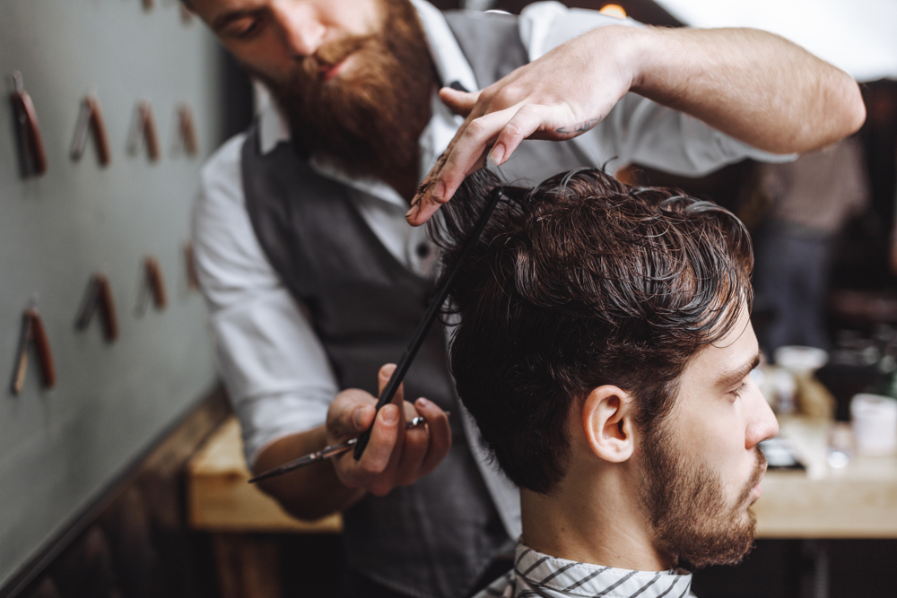 barber cutting client's hair