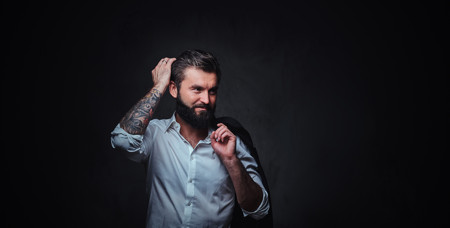 Man running fingers through hair