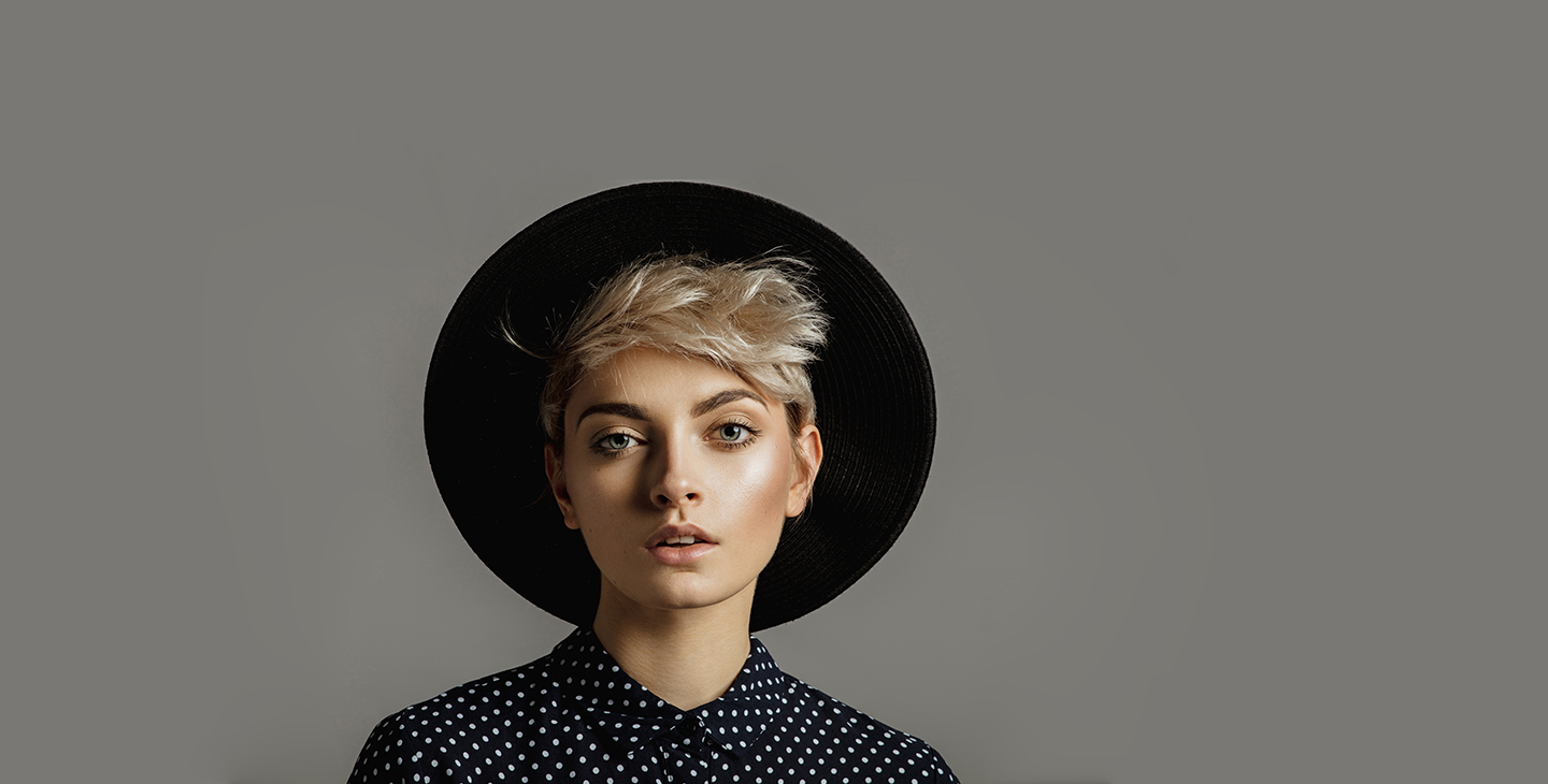 Woman wearing large black hat