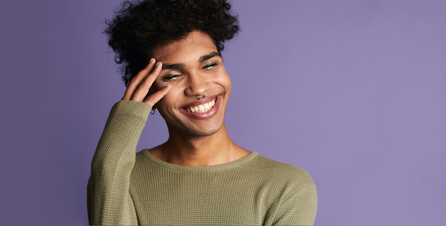 Smiling person on purple background